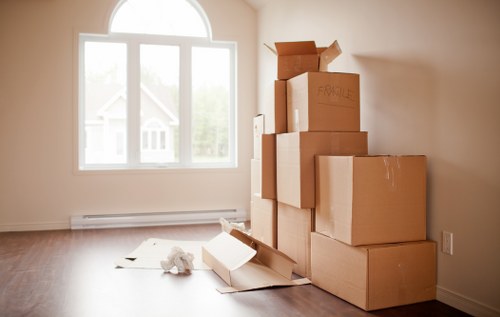 Removal team handling boxes in a Kennington flat move
