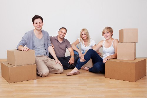 Packed moving boxes and furniture ready for a home move in Kennington