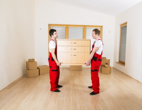 Loading furniture and boxes into a van for a Kennington removal job